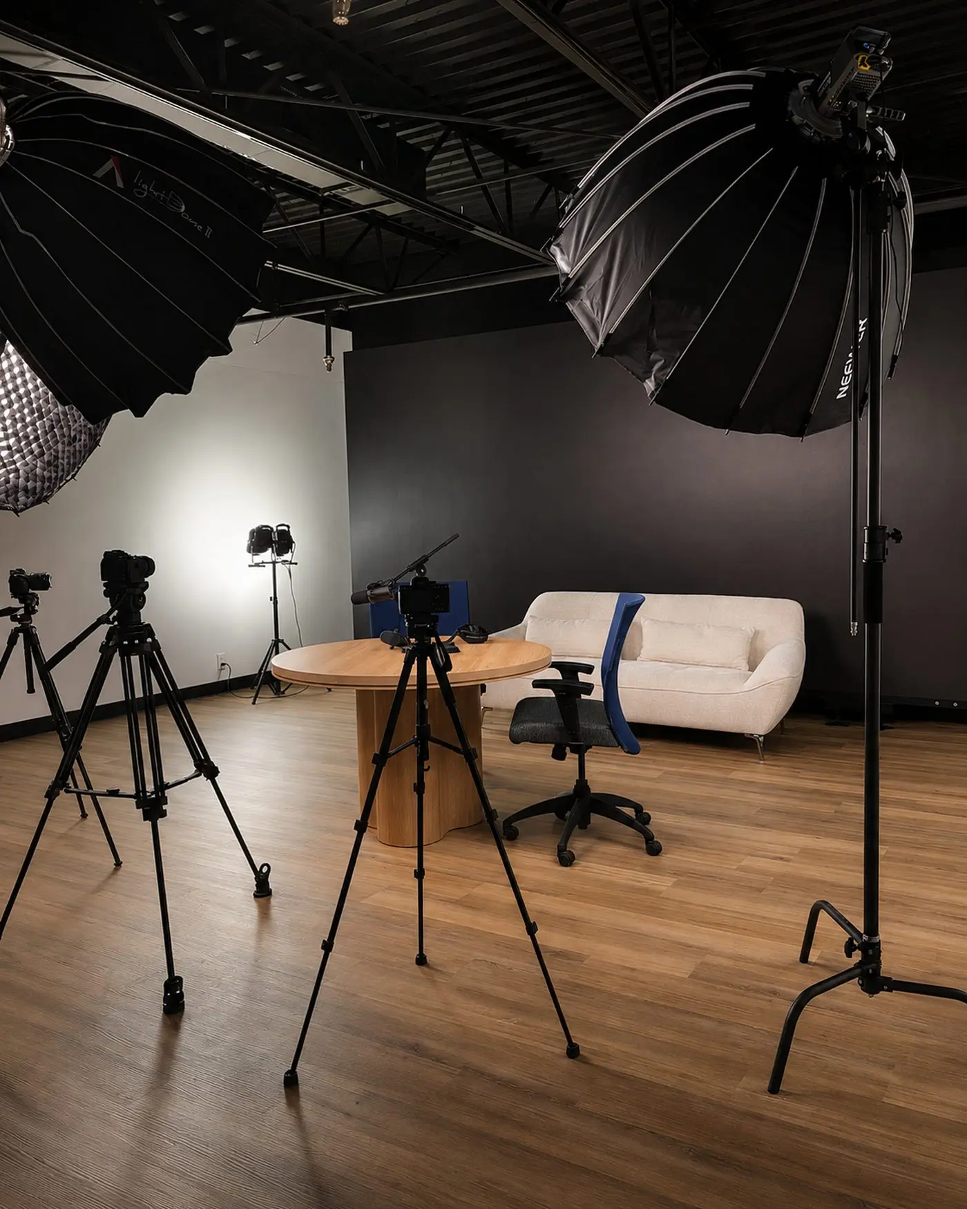 Exemplar studio set with cameras, lighting, and an interview table
